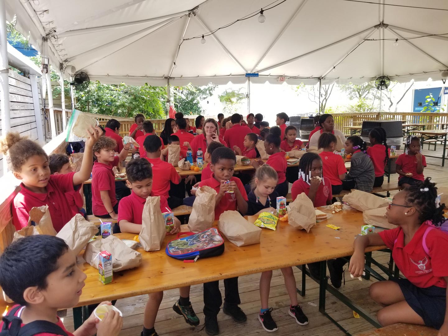 FSCA Kids Wearing Red Shirts Having Lunch On Sunny Day
